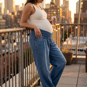 Crossover High Waisted Maternity Baggy Jeans with Pockets - rooftop terrace