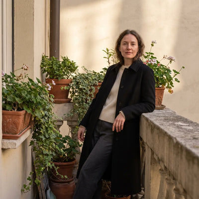 Women's Long Lightweight Coat - Black - balcony with plants