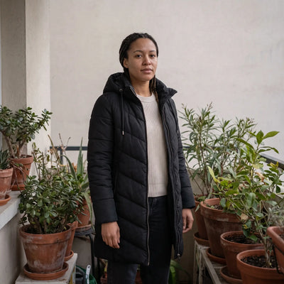 Women's Hooded Winter Coat - Black - balcony with plants