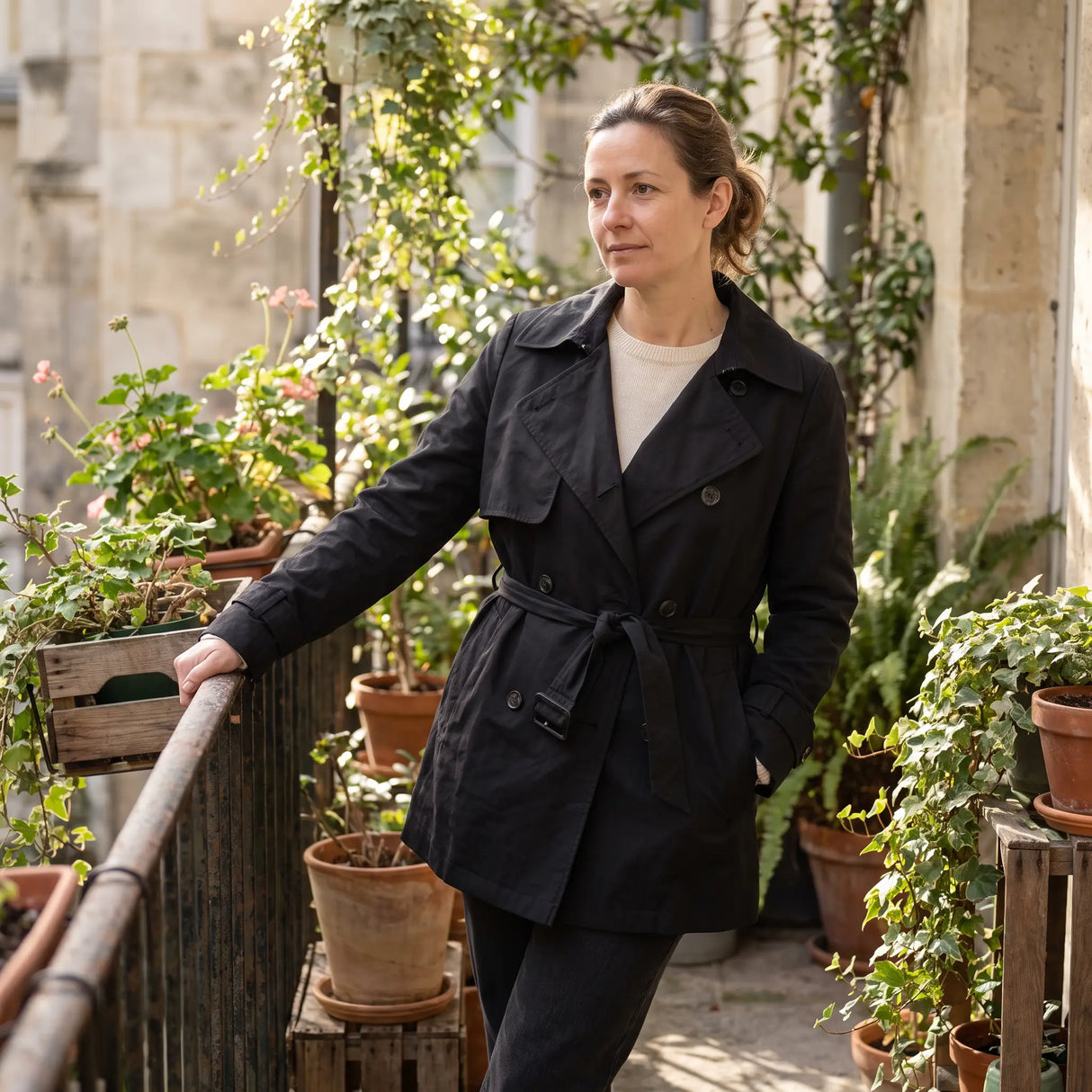 Women's Double-Breasted Short Trench Coat - Black - balcony with plants